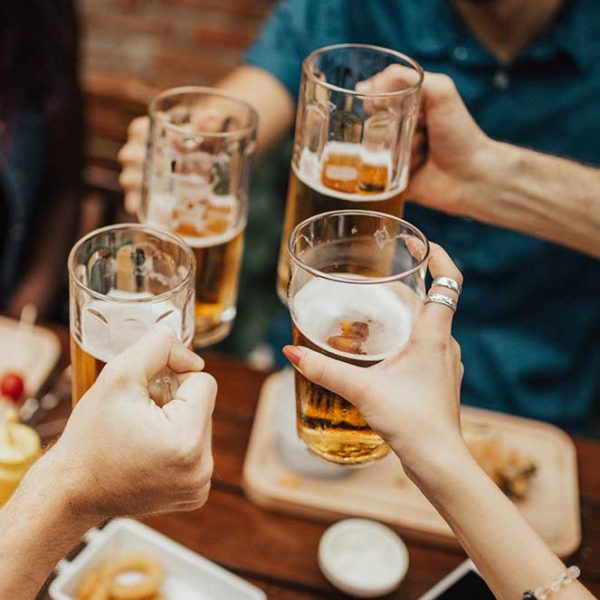 A photograph of a group of people drinking together